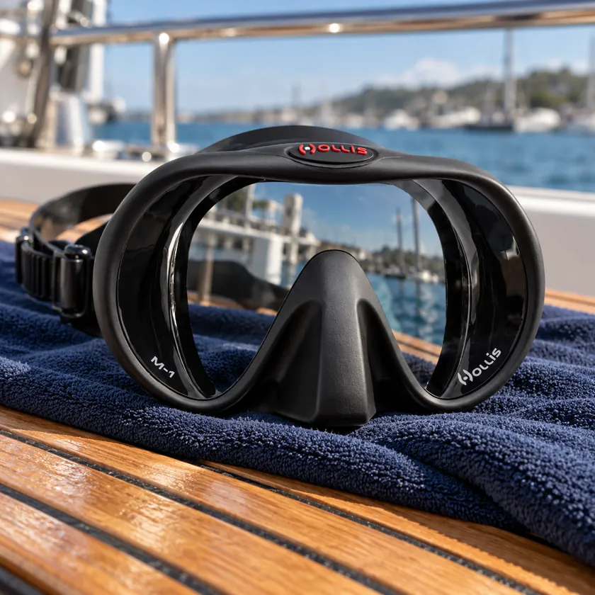 Generated product image of Hollis M1 resting on a towel aboard a dive boat